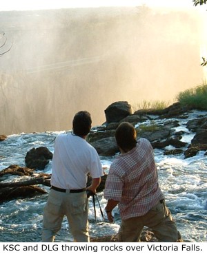 Kevin Cummings and Daniel Graf throwing rocks over Victoria Falls.