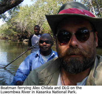 Boatman ferrying Alex Chilala and Daniel Graf on the Luwombwa River in Kasanka National Park.